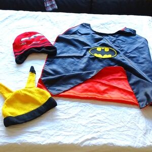 Boy pikachu beanie, lightning McQueen, and double-sided batman/superman cape